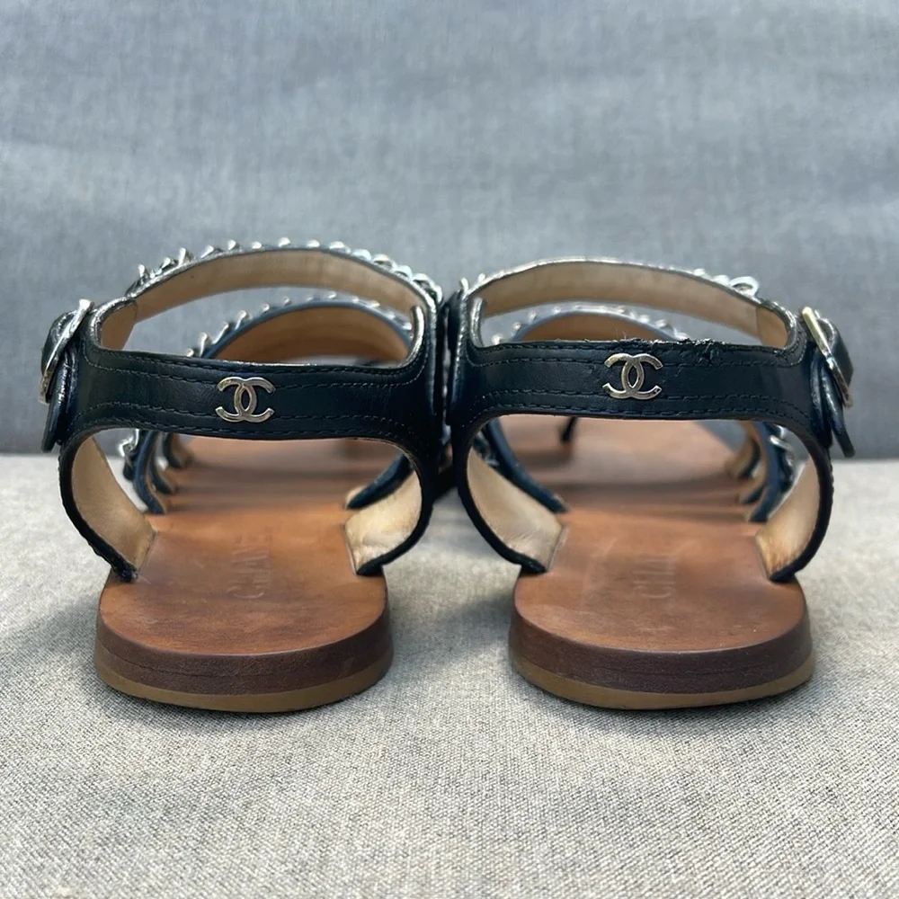 CHANEL Strappy Flat Sandal in Black Leather and Silver Chain Detail